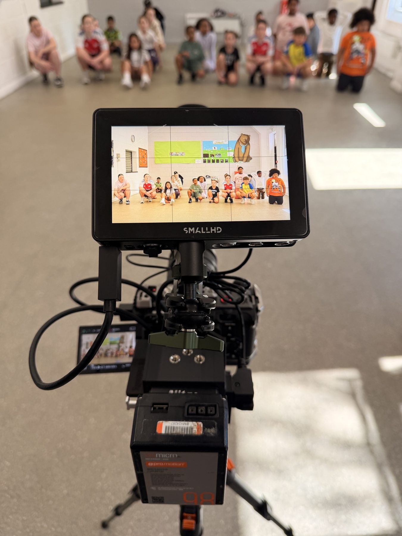 Zara Richards directing a class on set, April 2026